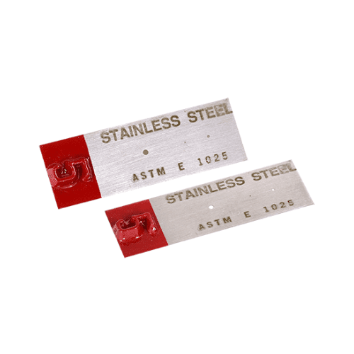 An ASTM e1025 penetrameter on a white background for legibility.